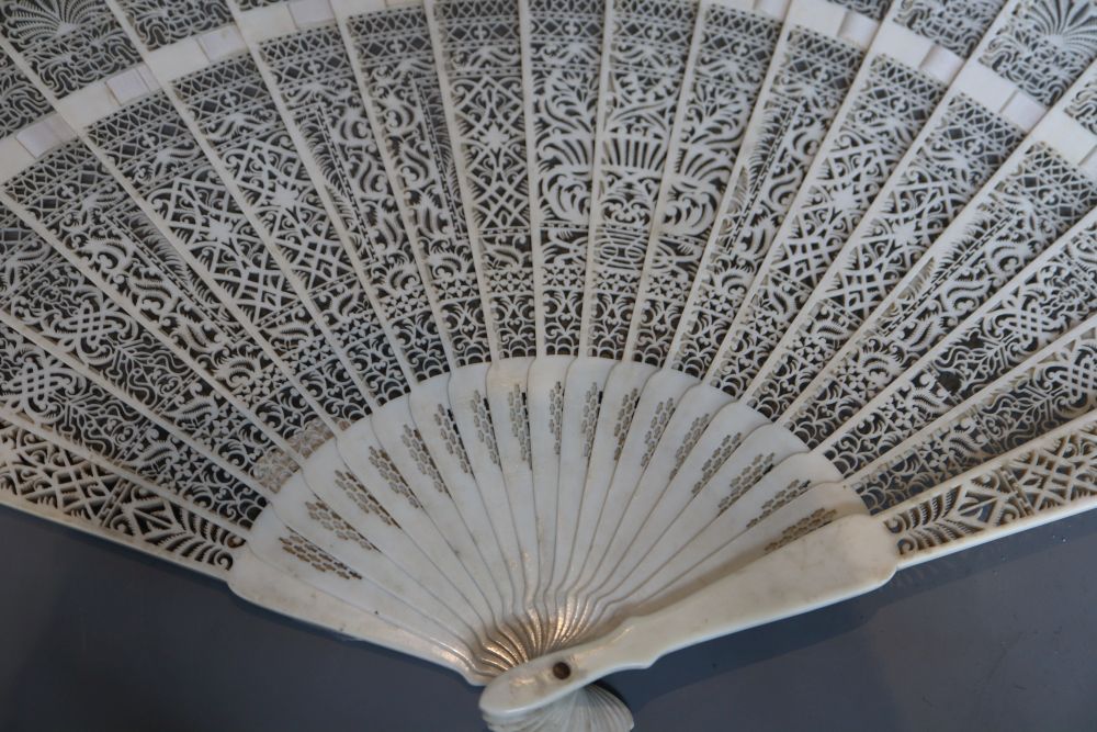 A 19th century French pierced ivory brise fan, length 28cm